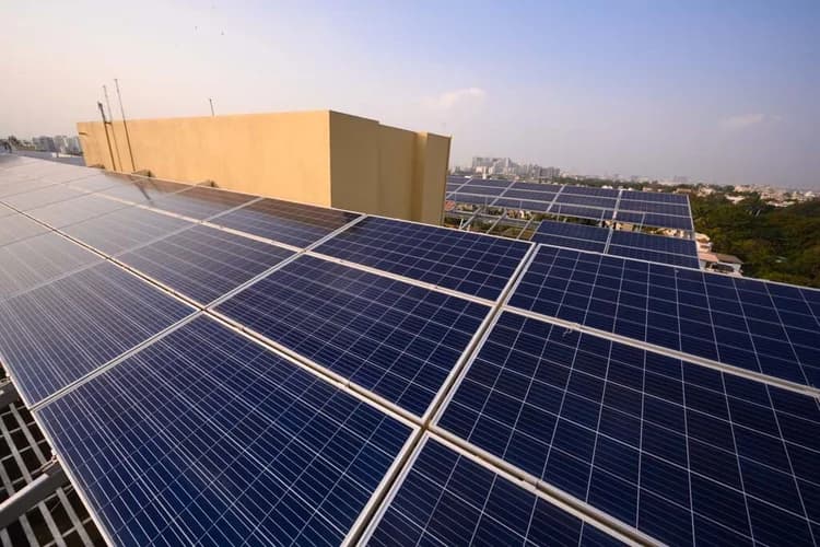 Scorpio's rooftop solar array with the Pune skyline