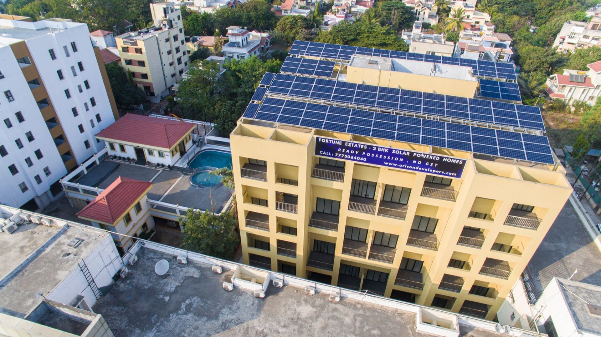 Aerial cityscape with Scorpio's solar roof in context